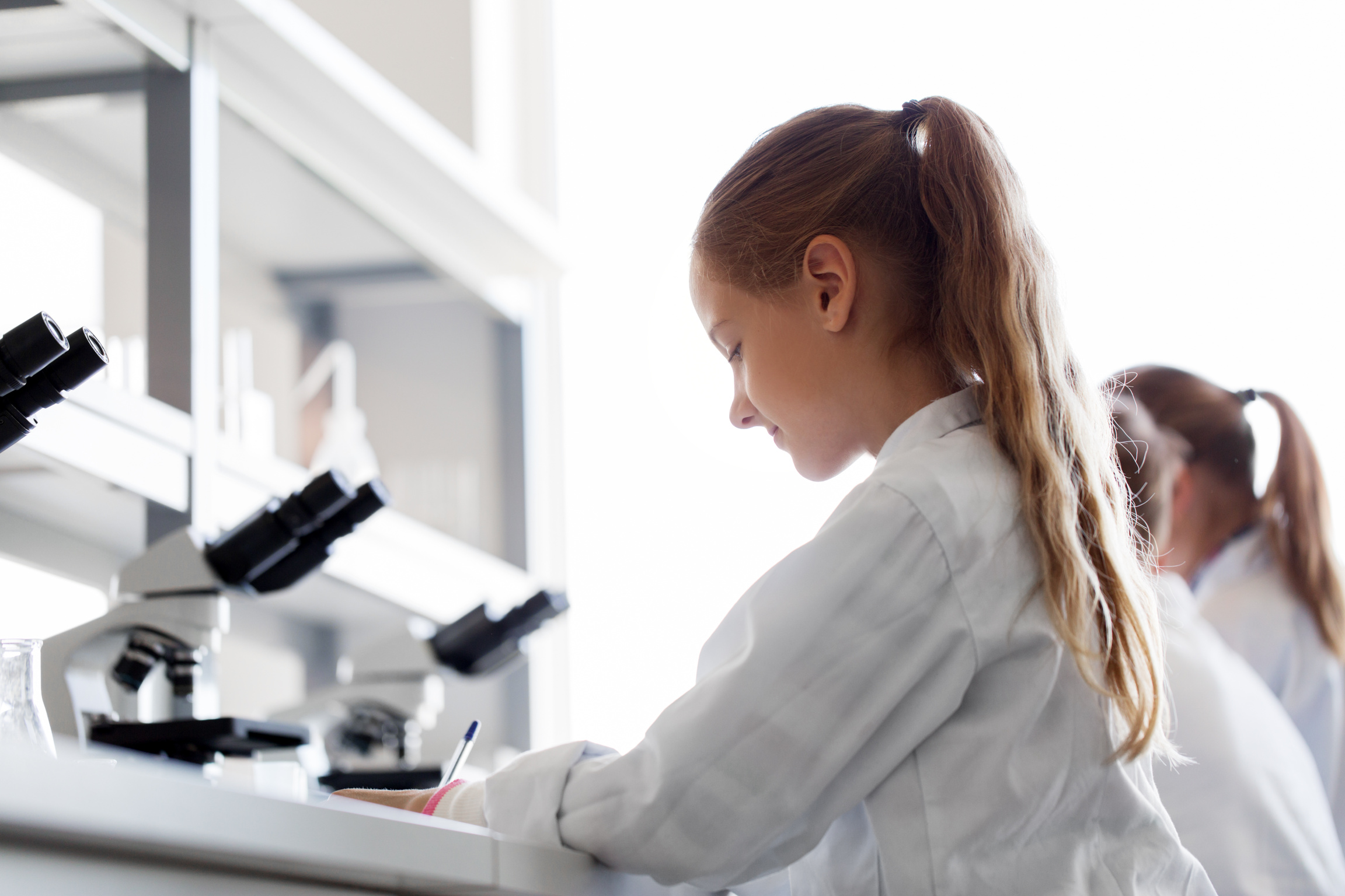 Girl Studying Chemistry at School Laboratory